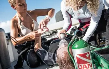 Two Atlantic Scuba Adventures Diver resuscitating diver on deck
